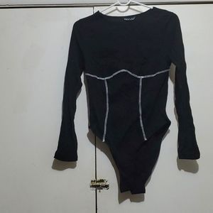Black bodysuit with white stitching detail